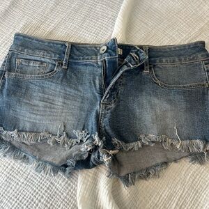 Distressed denim shorts with glitter details